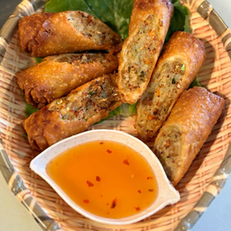 Whole fried fish with salad and dipping sauce