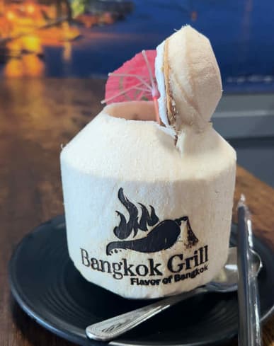 A Bangkok Grill cafe drink topped with cream